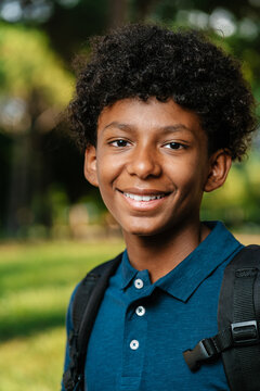 Glad black student looking at camera