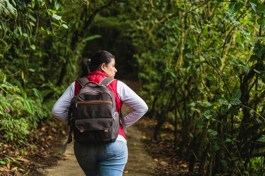 Woman Walking In The Forest