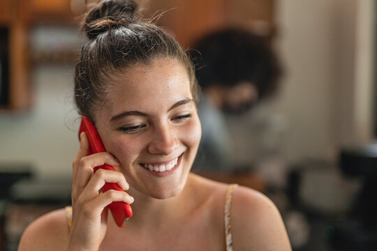 Portrait of a smiling woman making a phone call