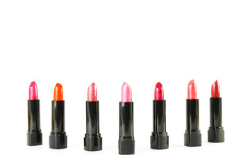 Obraz premium Close up shot of a single glossy lipstick isolated on white background with a lot of copy space for text.