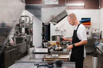 Man working in restaurant kitchen