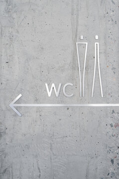 Creative WC sign on wall in restaurant