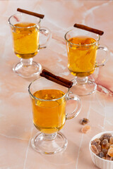 apple cider in a glass on a marble table