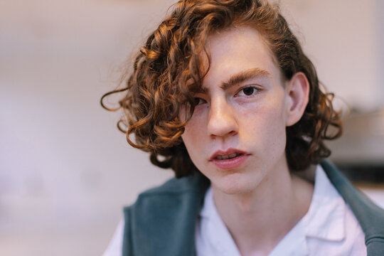 Stylish Teenager with Long Hair looking at camera