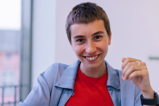 Androgynous girl smiling at camera