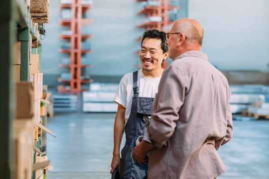 Two Men Working in Factory 