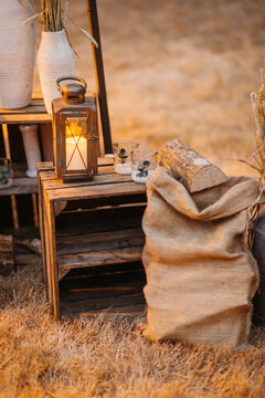 outdoor still life with candle and burlap bag