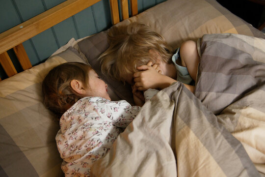 Three little kid in a bedtime 