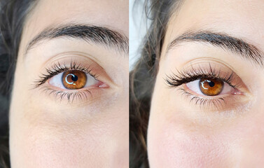 Close up of opened hazel eye with eyelash Extensions in beauty salon macro view.before and after