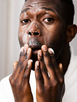 Man With Refreshing Face Wash On His Face