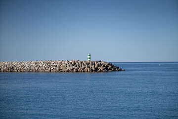 A day at the beach. Lovely colors and the sea just ahead in the village of Nazaré where the...
