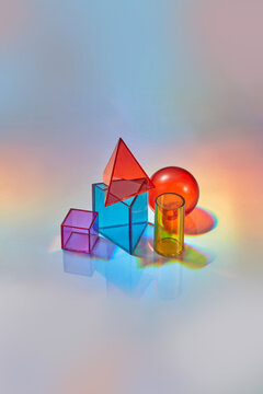 Various multicolored geometric glass shapes.