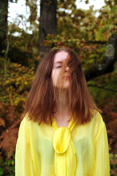 The young woman in a yellow blouse