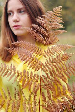 The young woman in a yellow blouse