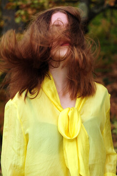 The young woman in a yellow blouse