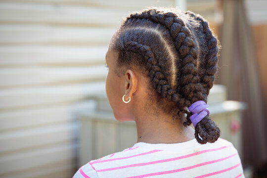Child with cornrow braids