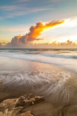Obraz premium Scenic vertical view of the beautiful Jensen beach in Florida during a mesmerizing sunrise
