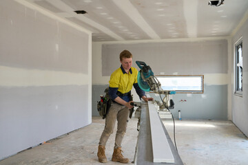 Young apprentice tradesman at work