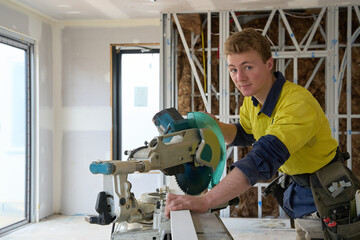 Apprentice carpenter at work