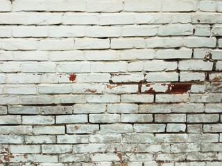 Cracked rusty white brick wall with a hole texture, background.