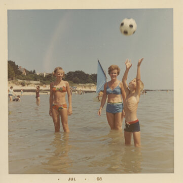 children playing ballgame in lake