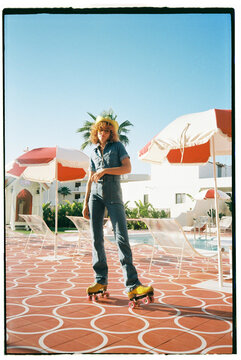 Roller-Skater Girl Posing In the swimming pool