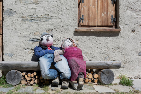 couple of puppets sitting close together.