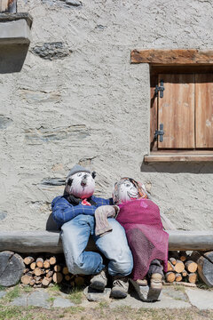 couple of puppets sitting close together.