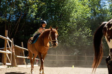 young girl riding horse