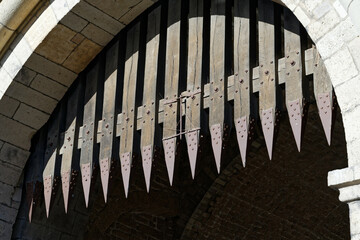 portcullis with metal spikes on a medieval gate castle in cologne