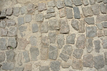 Natural old stone wall texture from the medieval castle with natural white light