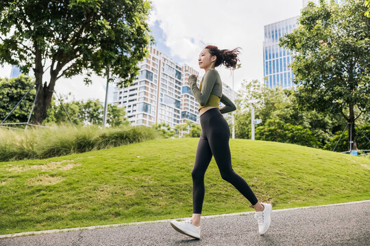 Sportswoman running in the park
