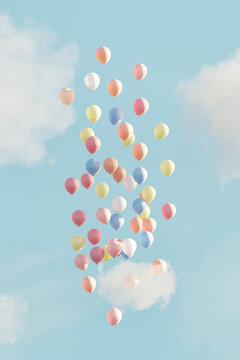 Colorful balloons floating in the sky with white clouds. 3D render.