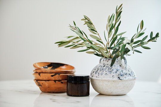Amber Jar, Wooden bowls and olive branches 
