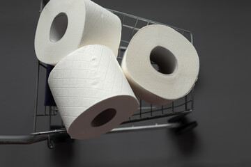 Toilet paper rolls in a supermarket trolley .Cleanliness and health.toilet paper shortage. View from above.