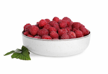 Bowl of fresh ripe raspberries with green leaves isolated on white
