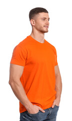 Obraz premium Man wearing orange t-shirt on white background. Mockup for design