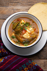 Mexican food. Tradicional rajas with cheese in red sauce.