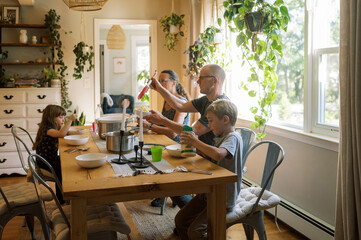 grandparents having dinner with their grandchildren