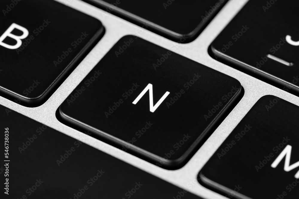 Aufkleber closeup shot of a grey keyboard layout with black keys and white font