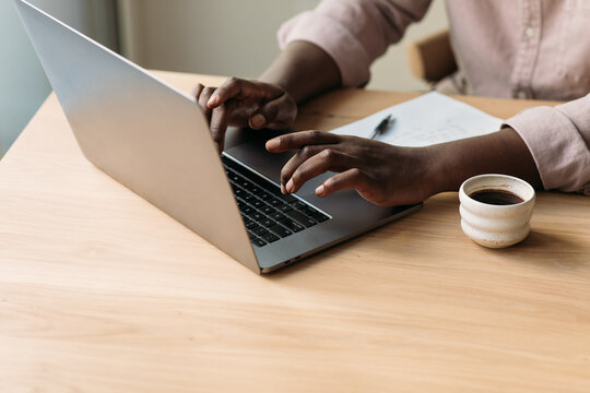 Man Working at Laptop - Powered by Adobe