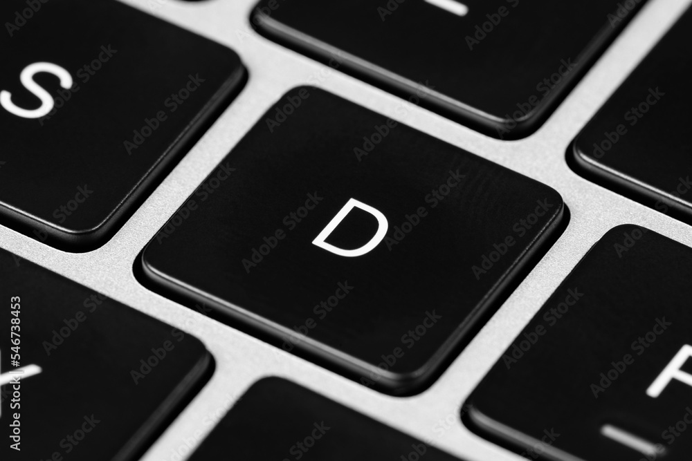 Poster closeup shot of a grey keyboard layout with black keys and white font