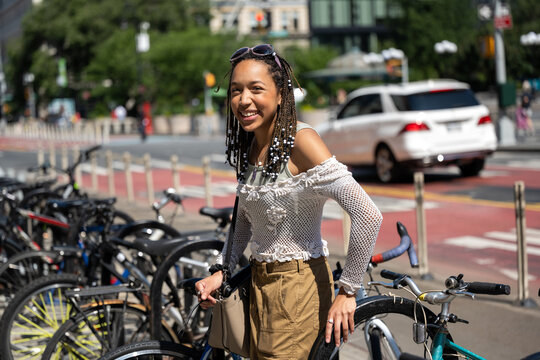 Hapy young person in the city with bike