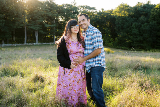 Expectant Couple hugging