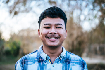 Portrait Asian young man smile with happy