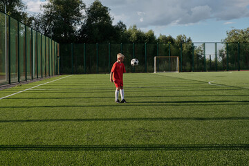 Kid Learning To Juggle Ball