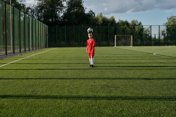 Junior Soccer Player Kicking Ball