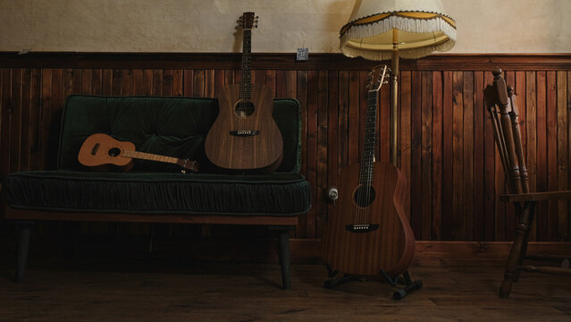 Guitars and ukulele in vintage interior. 
