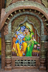 Beautiful framed art of Radha and Krishna, Hindu God, displayed for sale at famous Sardar Market and Ghanta ghar Clock tower in Jodhpur, Rajasthan, India.