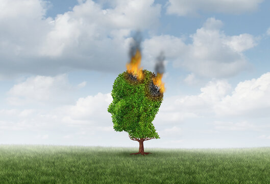 Alzheimer's Disease Awareness and dementia illness as a mental health concept as a burning tree shaped as a human head